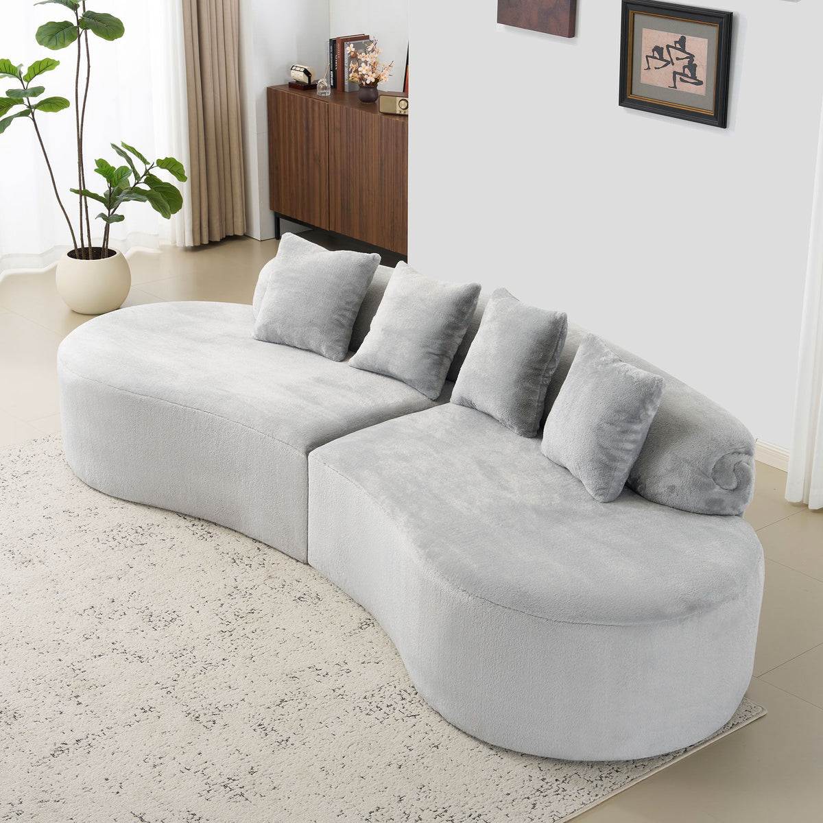 Sofá curvo moderno con almohadas
