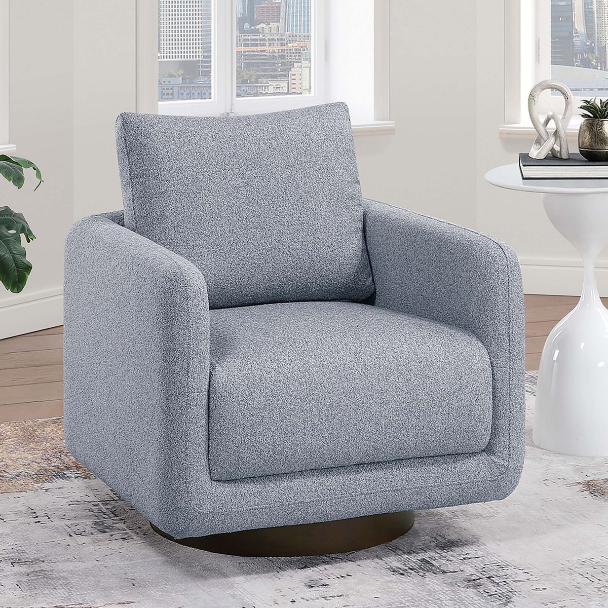Sillón decorativo giratorio tapizado